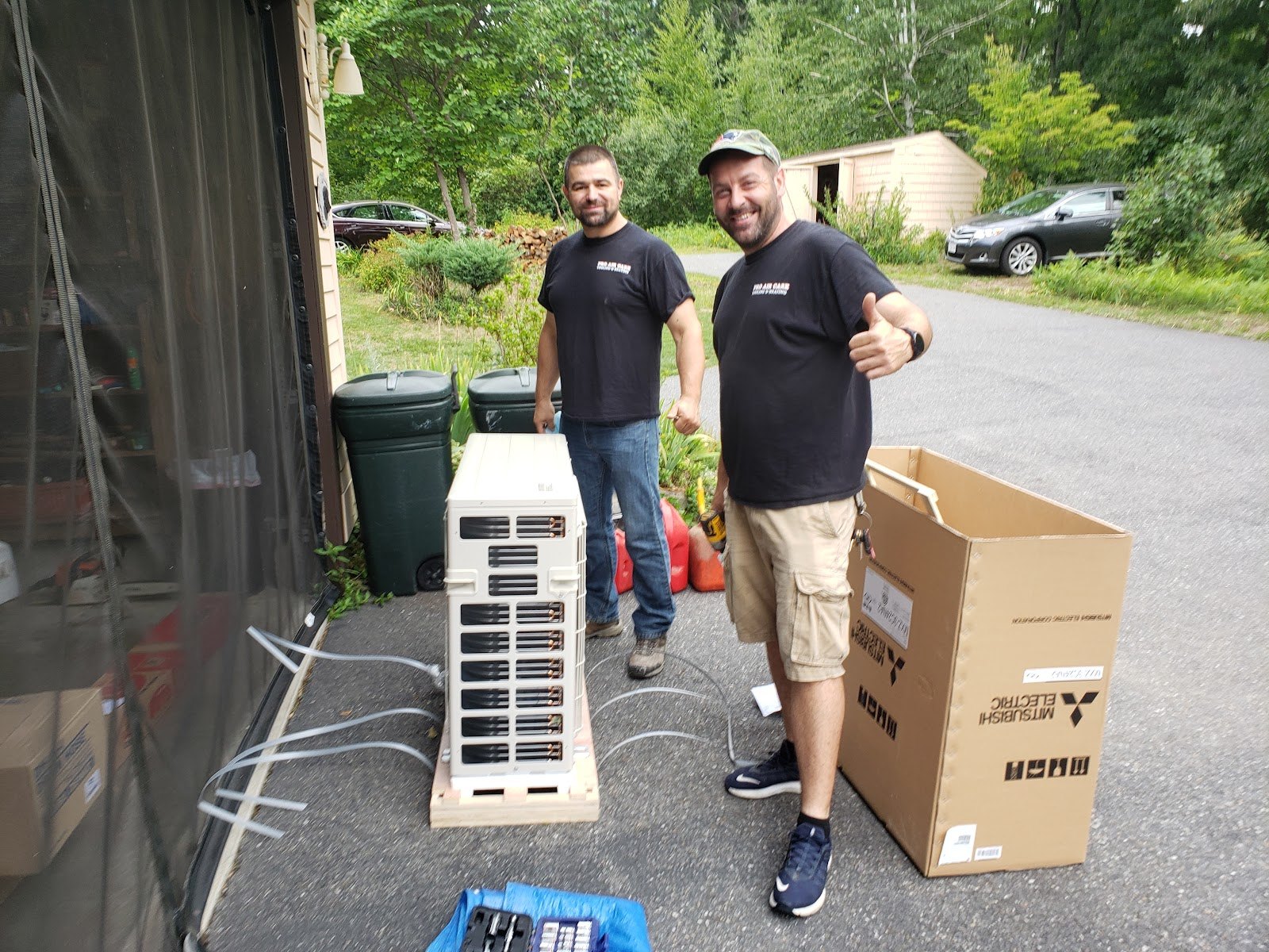 The Pro Air Care HVAC crew with a new ductless system before installation