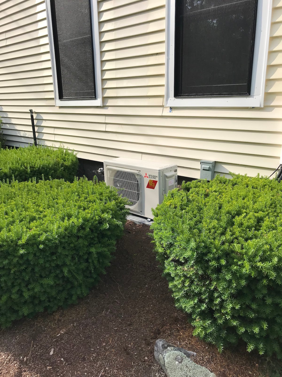 Central air condenser installed beside a Holden home by Pro Air Care HVAC